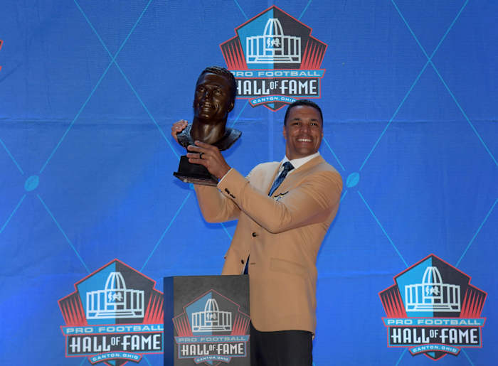 Aug 3, 2019; Canton, OH, USA; Tony Gonzalez poses with bust during the Pro Football Hall of Fame Enshrinement at Tom Benson Hall of Fame Stadium.